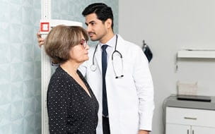 Why Do People Get Shorter as They Age?