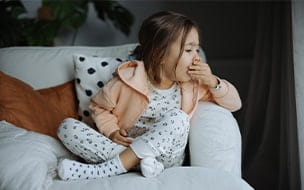 young child coughing