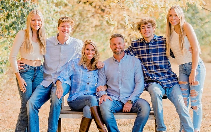 Jeremy Hardy poses with his wife and their four children
