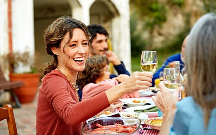 woman drinks wine at party