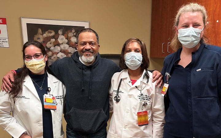 Paul Mynatt poses with his UH providers
