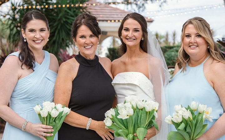 Patty Saunier and her family pose outdoors