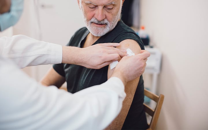 Senior man gets vaccine