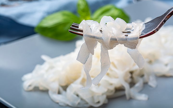 A forkful of white konjac shirataki noodles