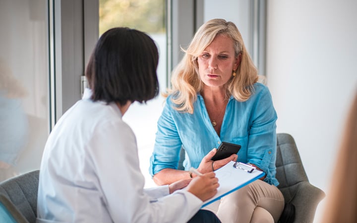 woman talks with her doctor