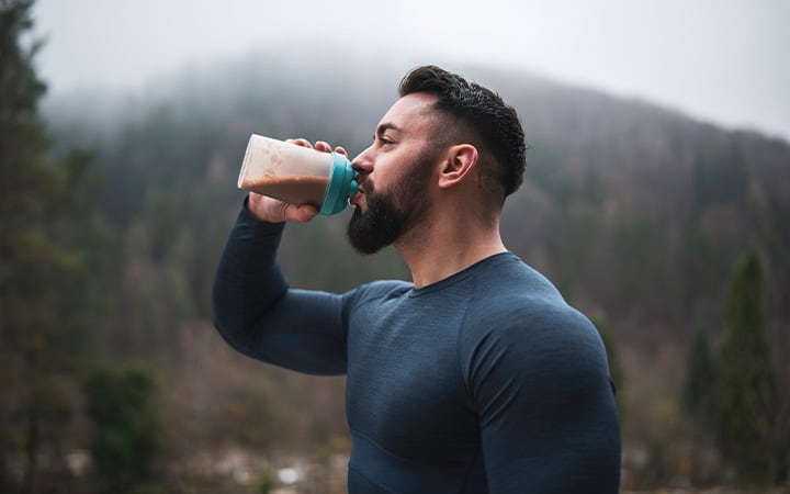 Man drinking a supplement