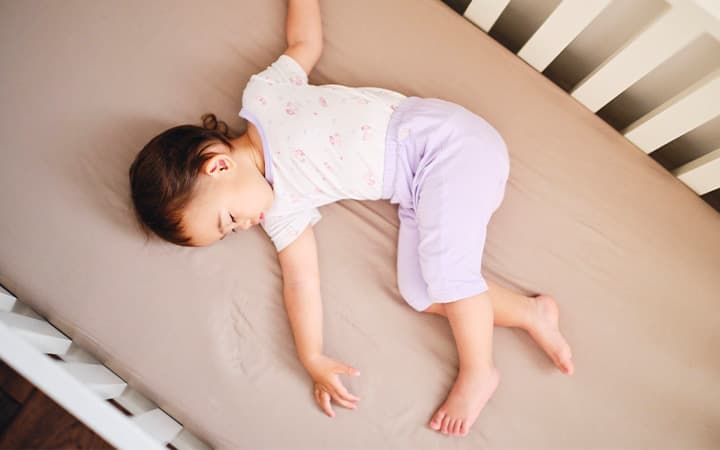 Baby sleeping in crib