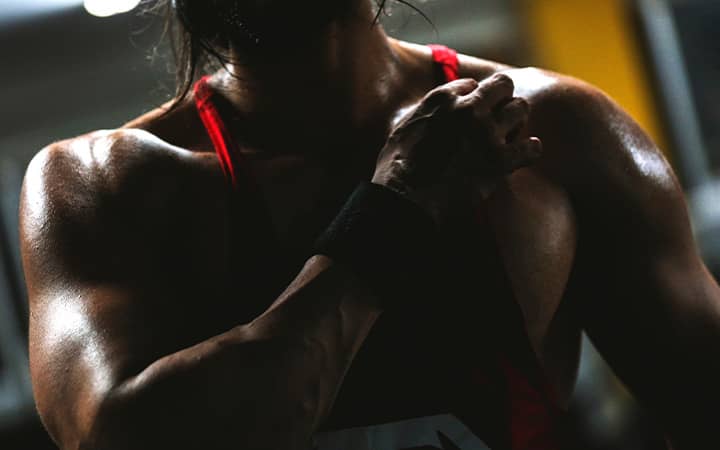 Closeup of the midsection of an adult man training at the gym