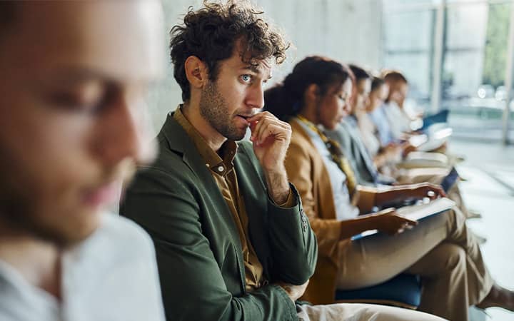 Anxious young man awaits job interview
