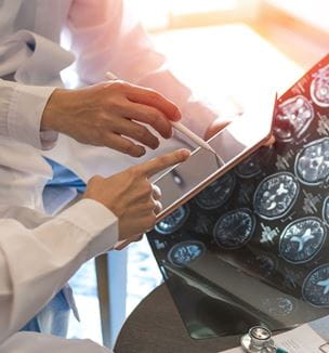 Image of doctors reviewing brain scan