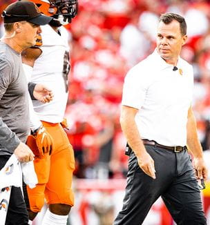 Image of Cleveland Browns and Dr. James Voos on field