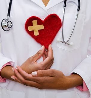 Doctor holding heart issue