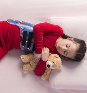 Child sleeping in Providence sleeping brace Photo Credit: Spinal Technology, LLC