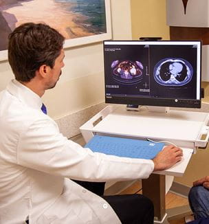 Dr. Pedro Barata viewing PET scan at UH Seidman Cancer Center.