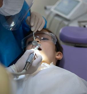 Pediatric patient at dentist exam