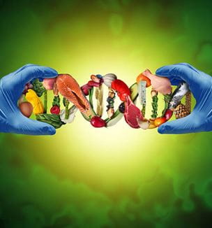 Gloved medical hands holding genetic food chain depicting science and food.