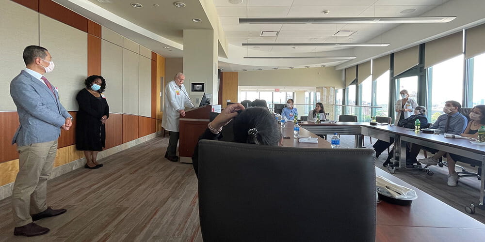 Dr. Devereaux congratulating course participants upon completion
