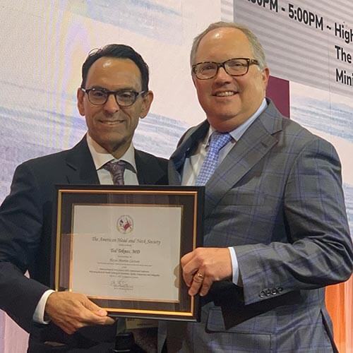 Dr. Teknos had the honor of delivering the Hayes Martin Lecture, he was introduced by his mentor, Dr. Brian Burkey, President of AHNS