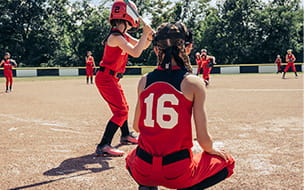Girls softball team practicing on field
