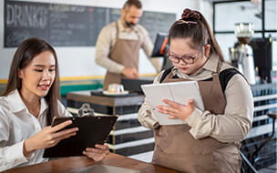 An autistic girl working in her family's coffee shop
