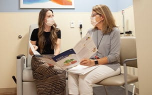Nutritionist working with patient on planning heart healthy meals
