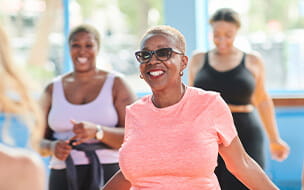 Women at the gym doing an indoor exercise class