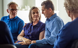Senior people sharing issues during group meeting