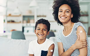 Smiling mother and son who got vaccinated