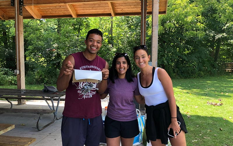 three residents at park during wellness retreat