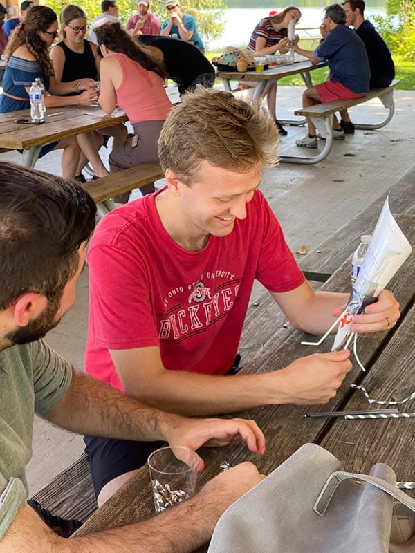 residents at table building project at wellness retreat