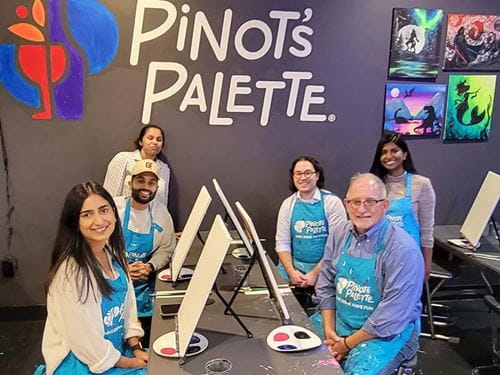 residents at a painting class