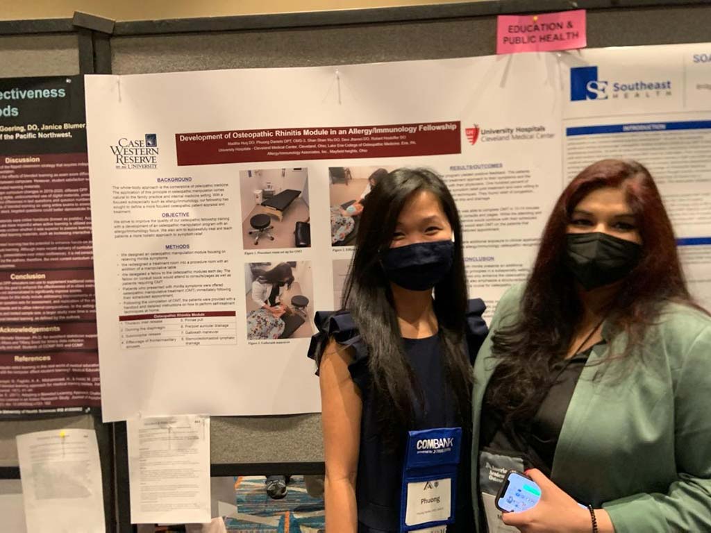 osteopathic student with research poster