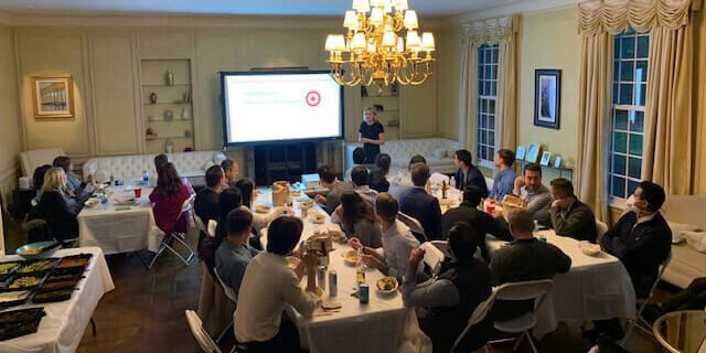group of fellows at a dinner meeting