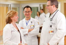 UH Parma-Department of Education-three doctors in hallway talking