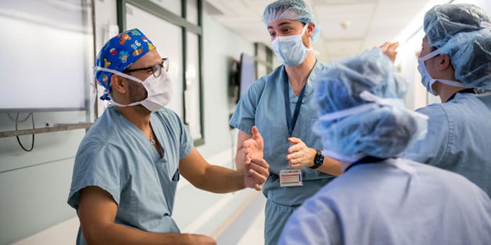 physicians in hall talking