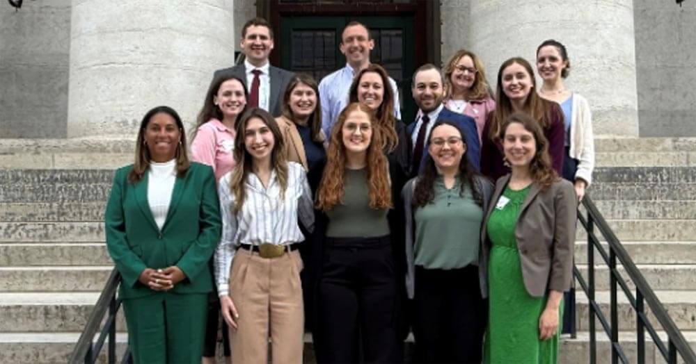 group of residents posing on stairs