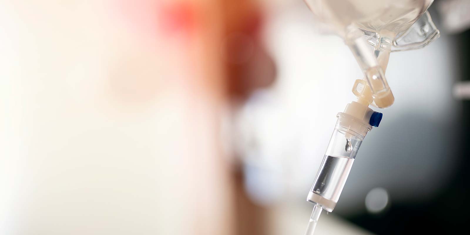 Nurse adjusting IV