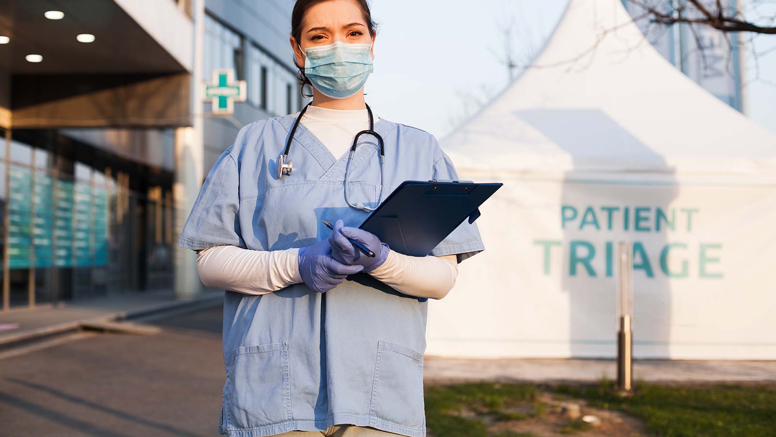 nurse at patient triage tent