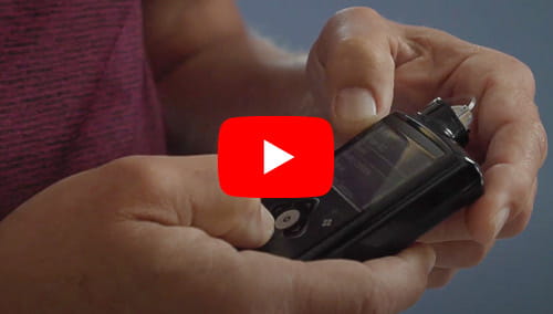An EDIC study participant holds an electronic device