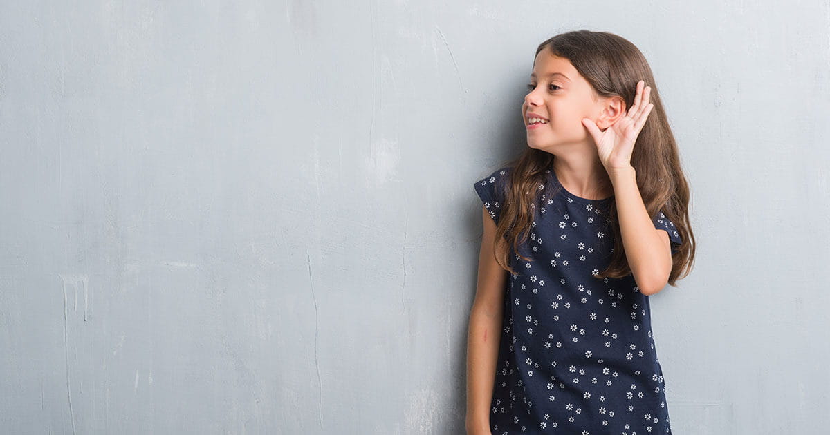 girl cupping her ear
