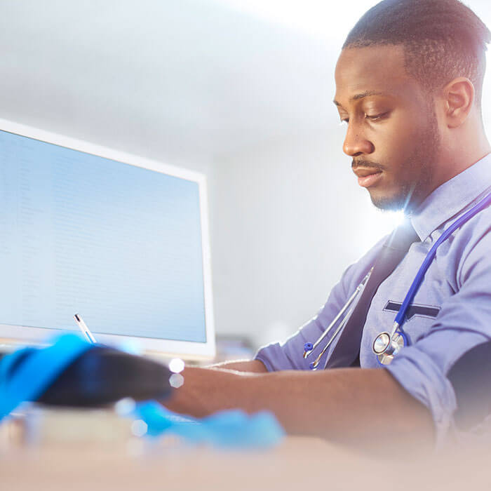 physician at computer
