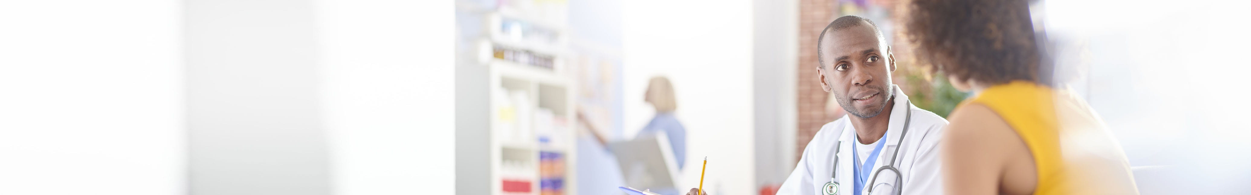 Physician talking with patient