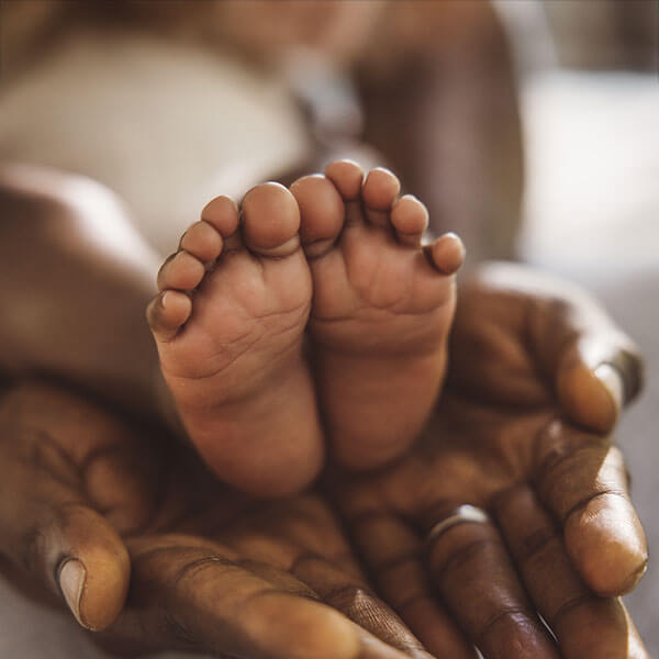 mother holding her baby's feet