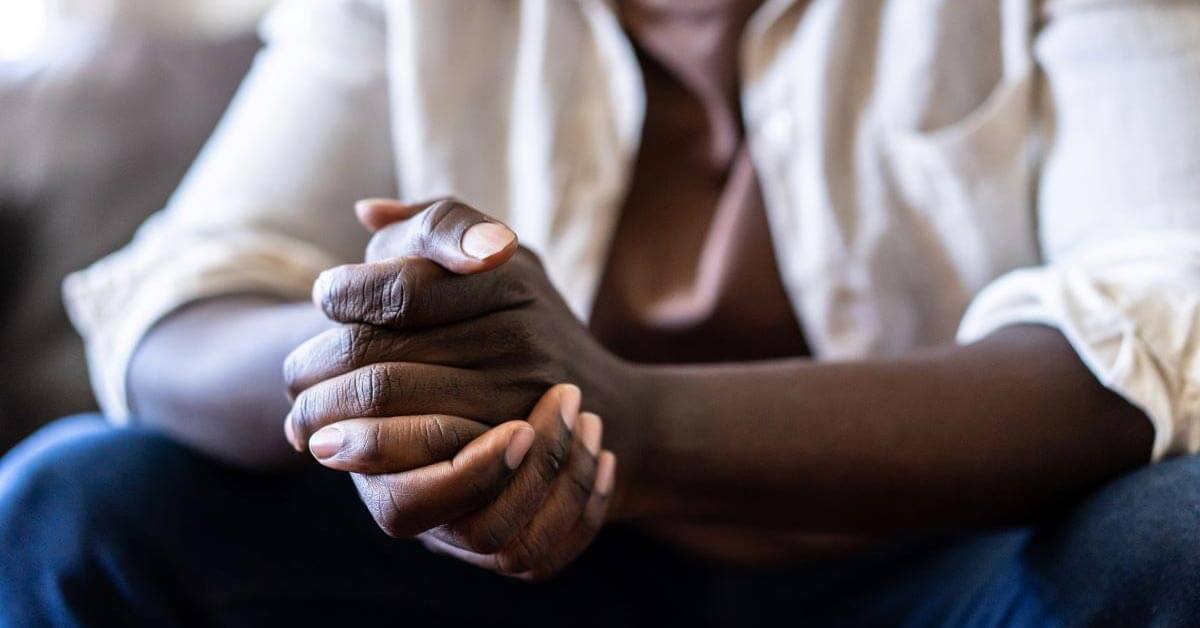 man folding hands