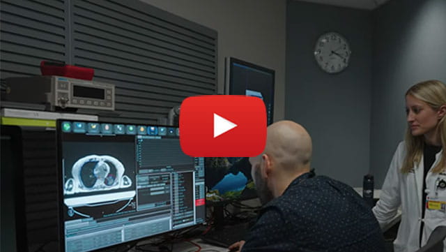 Radiation oncologists reviewing imaging