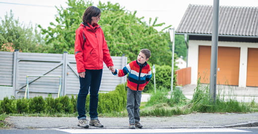 Mom and child crossing the street.