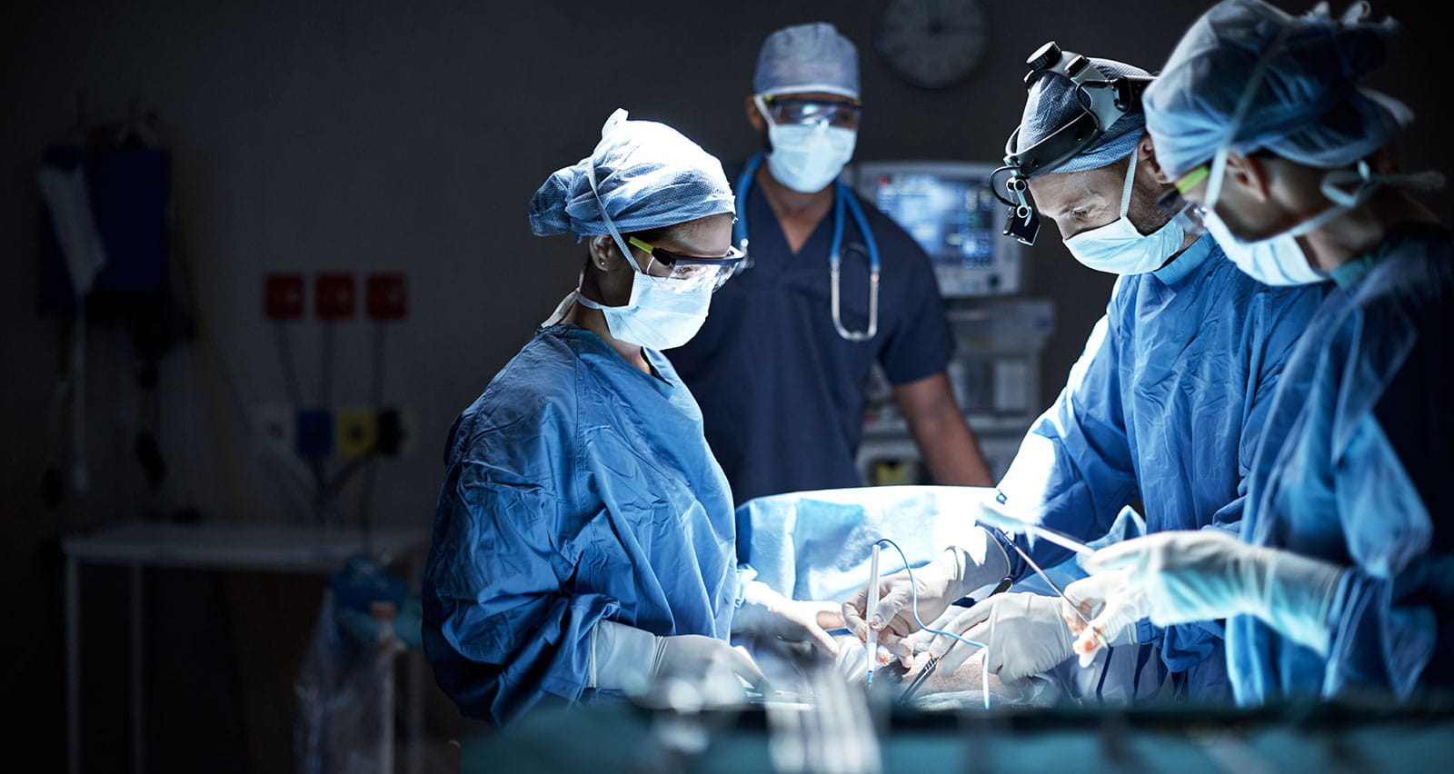 A team of surgeons performing pediatric heart surgery in an operating room