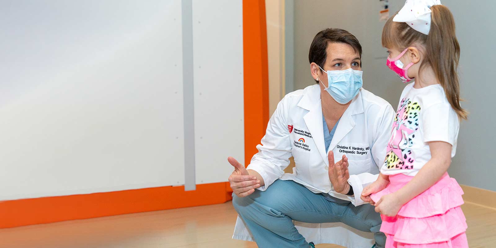 Dr. Christina Hardesty Orthopedic Surgeon with patient