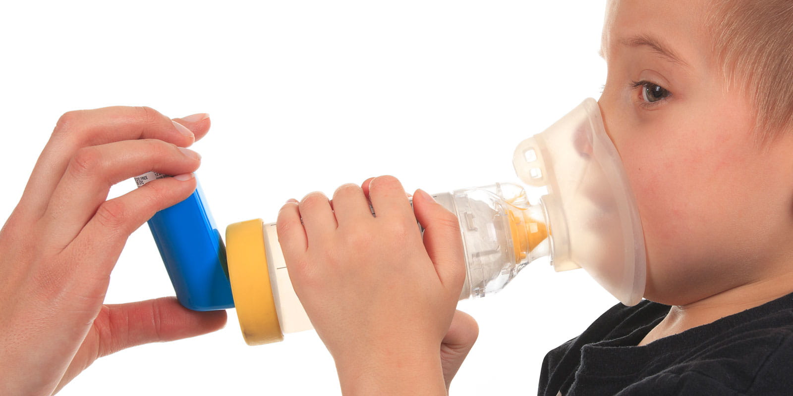 Boy holding an inhaler