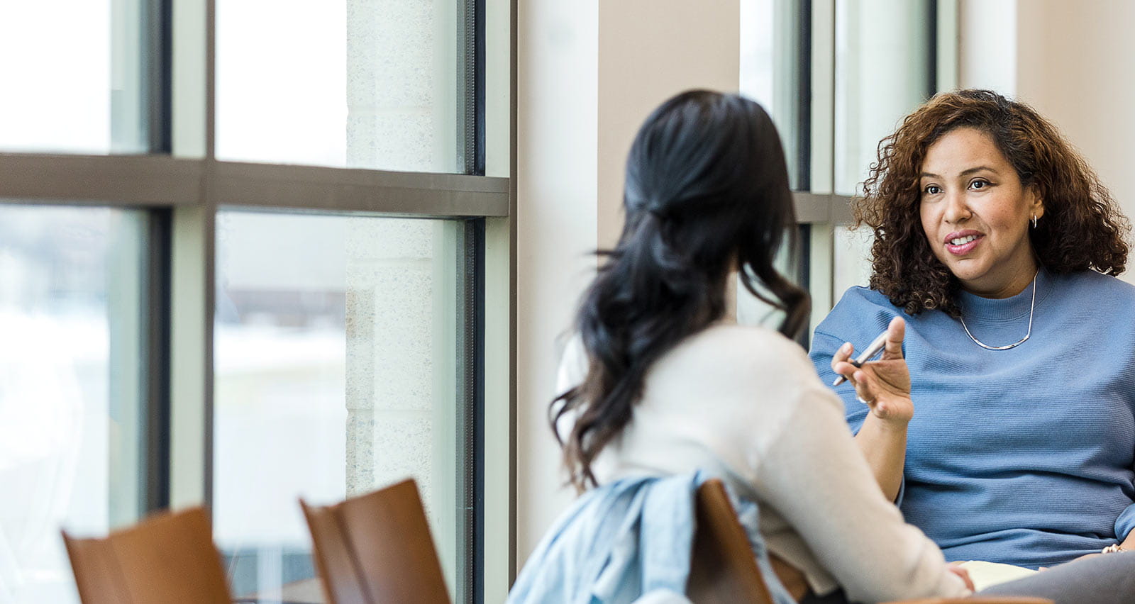 A female client listens as female counselor gives advice